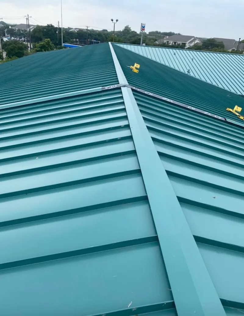 Green commercial metal roof ridge and valley for Metal Roof Repair in South Bend