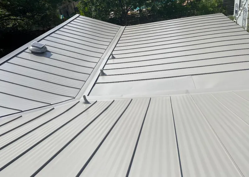 Solar attic fan installed on a metal roof for Roof Ventilation in South Bend